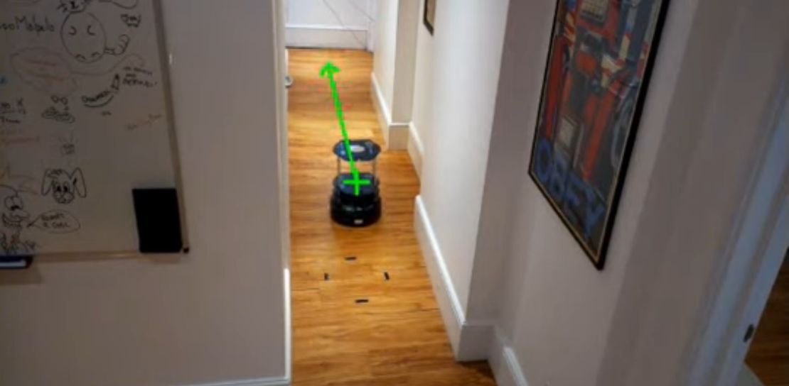 Building-Scale Robot Navigation via a Relay of External Cameras